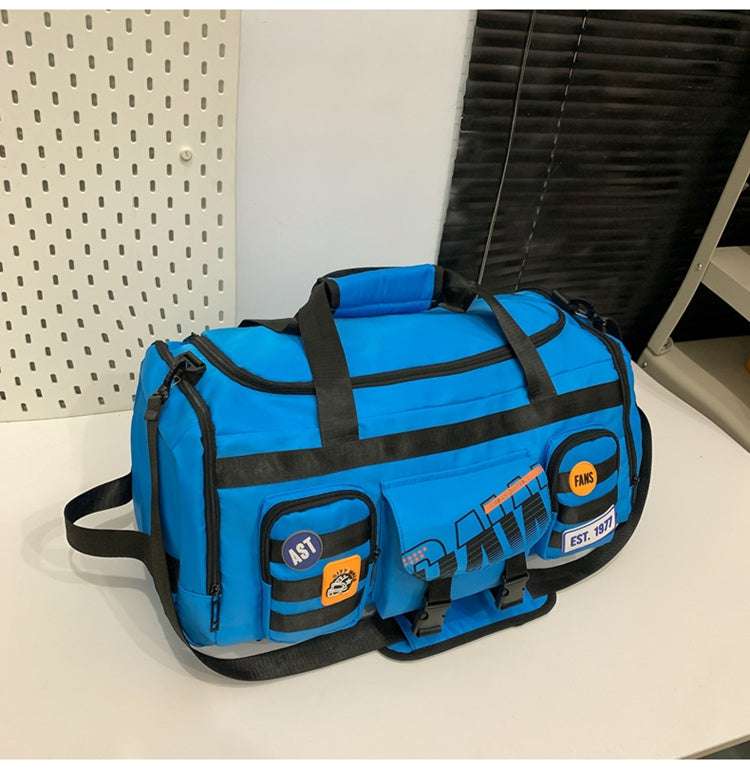 Feldacks blue outdoor sports fitness duffel bag with black straps and multiple pockets