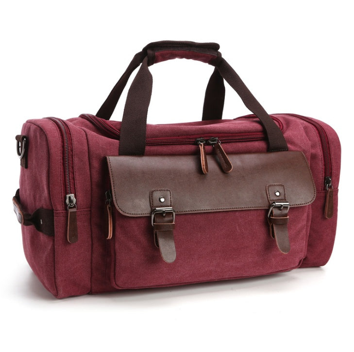 Feldacks CanvasFlex duffel bag in burgundy canvas with brown leather straps and multiple zippered compartments