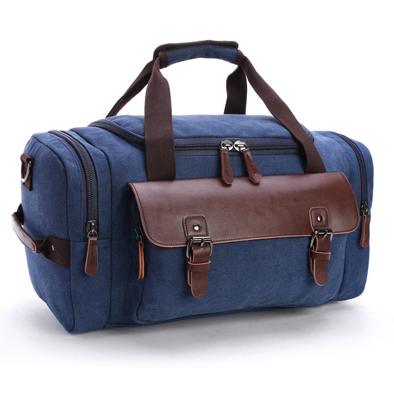 Feldacks blue CanvasFlex duffel bag with brown leather flap and multiple zippered compartments