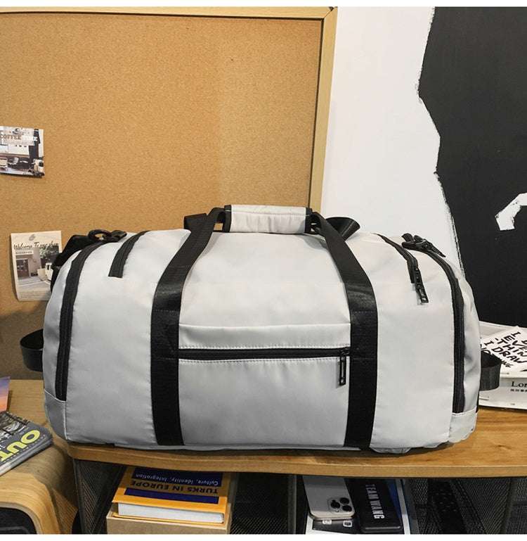 Feldacks outdoor sports fitness duffel bag in light gray with black straps and multiple zippered compartments