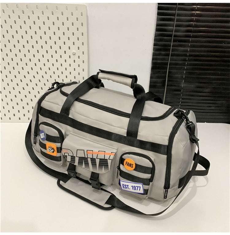 Feldacks beige and black outdoor sports fitness duffel bag with multiple front pockets and adjustable shoulder strap