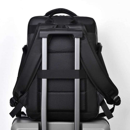 Feldacks large capacity business backpack shown from the back with padded straps on suitcase handle