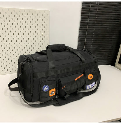 Black Feldacks outdoor sports fitness duffel bag with multiple front pockets and adjustable shoulder strap