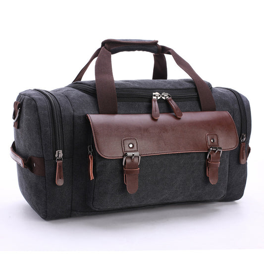 Feldacks CanvasFlex duffel bag in charcoal with brown leather accents and multiple zippered compartments