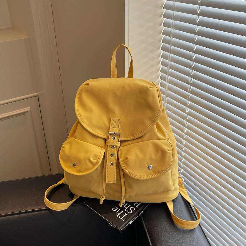 Feldacks yellow casual all-match backpack for women with front pockets and buckle detail