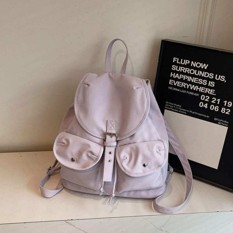 Light purple casual all-match backpack for women by Feldacks with front buckle and pockets