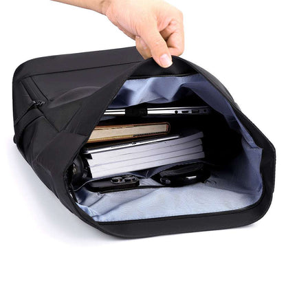 Feldacks durable everyday laptop bag backpack opened showing organized compartments with laptop and books