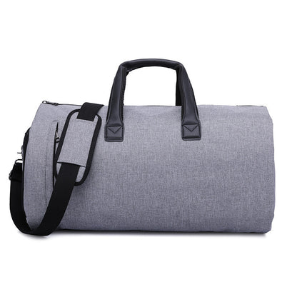 Feldacks foldable duffel bag for travel in gray with black handles and shoulder strap