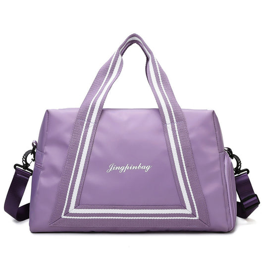 Purple large waterproof duffel bag with striped handles and detachable shoulder strap