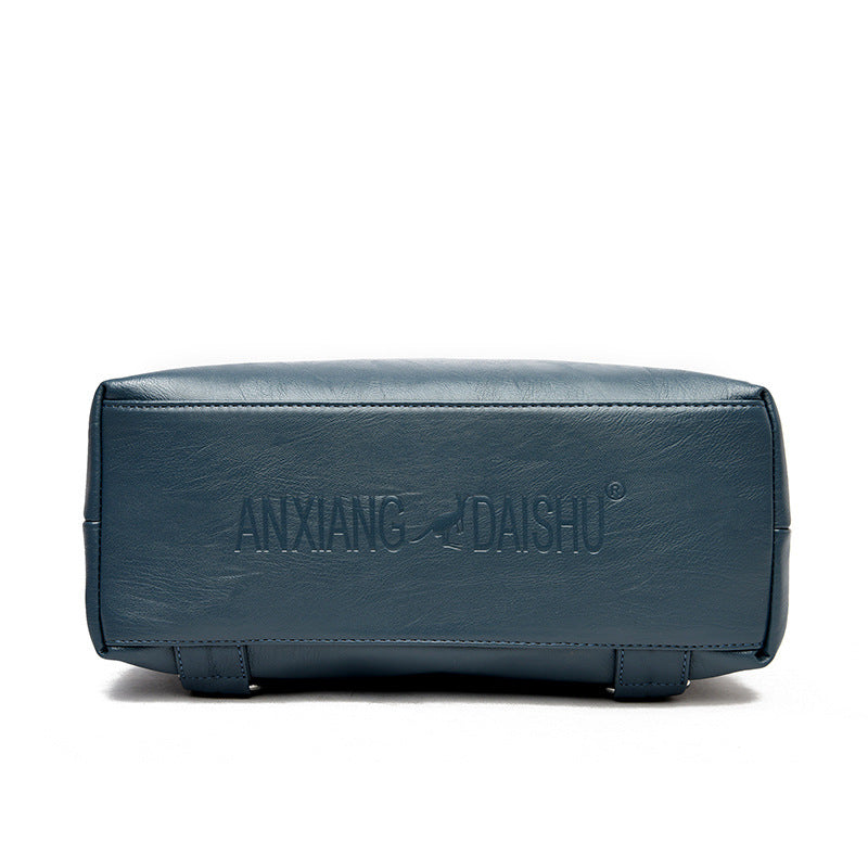 Bottom view of a blue secure travel backpack for women by Feldacks showing sturdy base and stitching