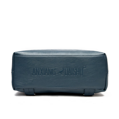 Bottom view of a blue secure travel backpack for women by Feldacks showing sturdy base and stitching