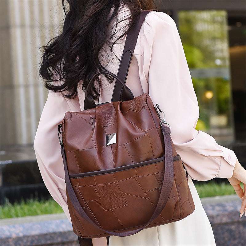 Feldacks stylish travel backpack purse in brown leather worn by woman with adjustable shoulder straps