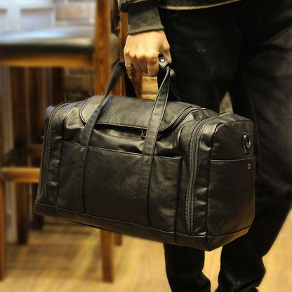 Feldacks urban style PU leather weekend bag in black carried by hand with multiple compartments