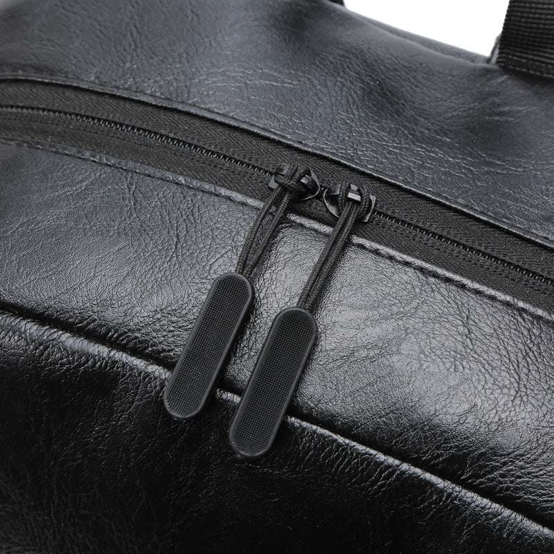 Close-up of black leather zipper detail on Feldacks UrbanFlex men's laptop backpack