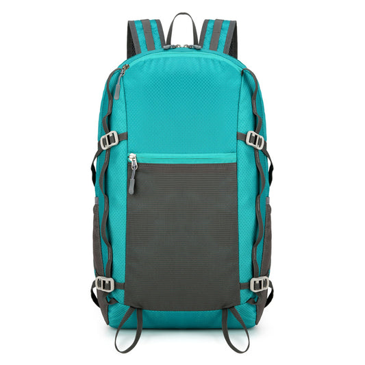 Feldacks lightweight backpack for trekking in teal with black front pocket and adjustable straps